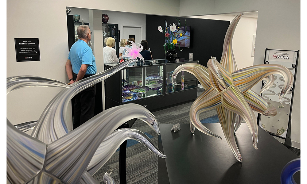 Rico with guests in the Hot Glass Gallery