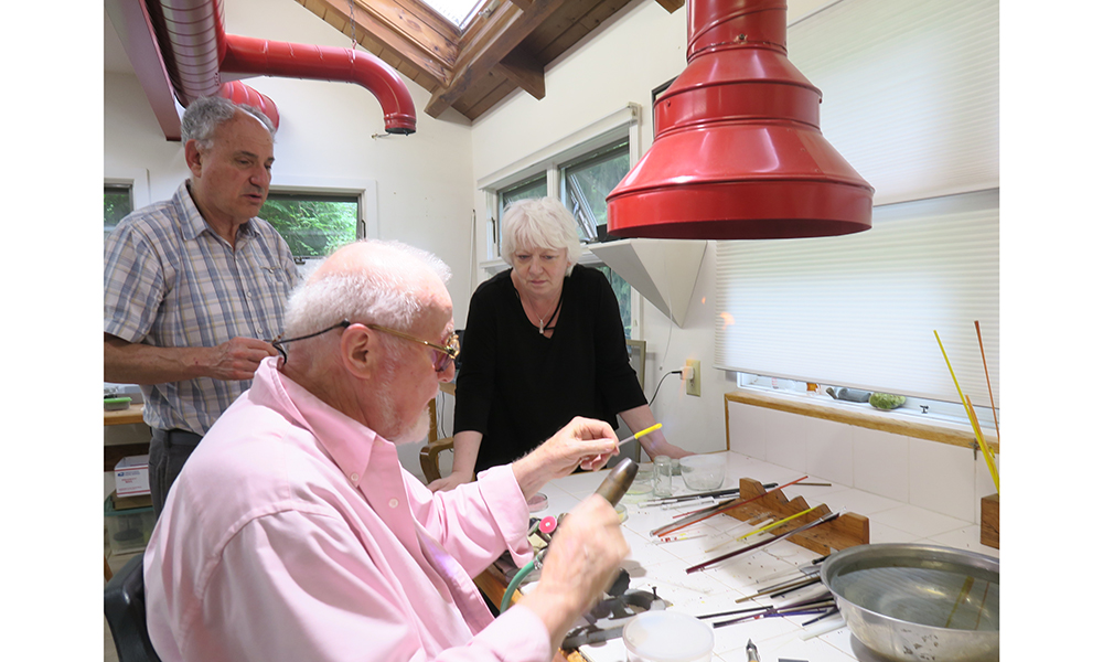 Arthur and Louise watching Paul at work