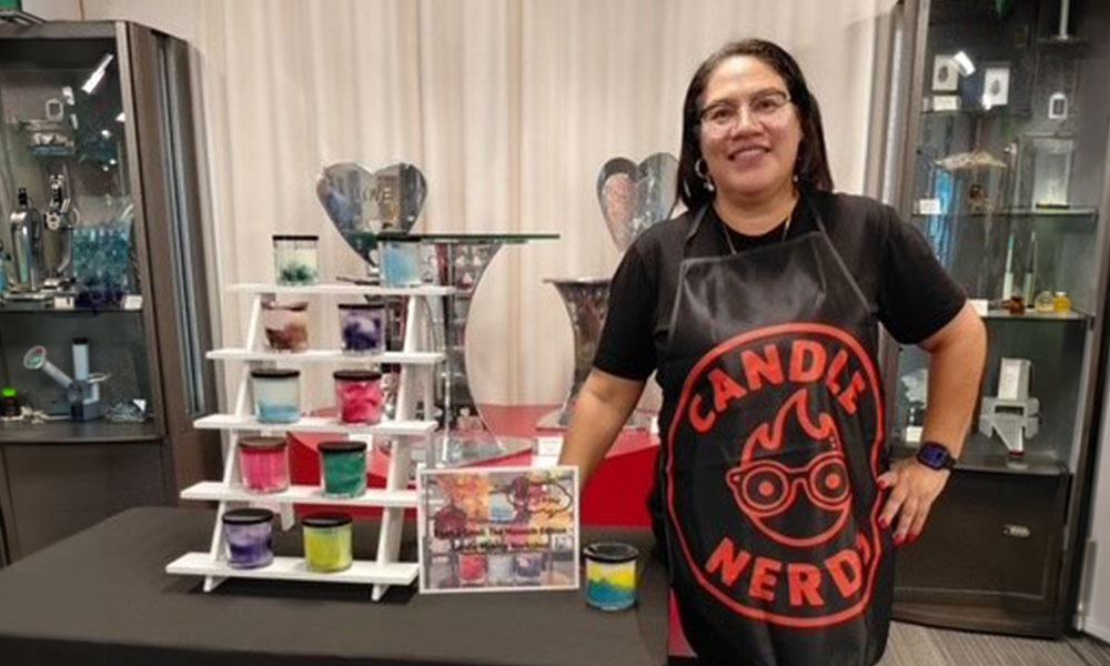 Nini from Candle Nerds at WMODA with a selection of candles